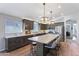 Spacious kitchen featuring a large island, modern appliances and stylish pendant lights at 10333 E Gold Nugget Ct, Gold Canyon, AZ 85118
