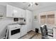 Well-organized laundry room with washer, dryer, cabinets, and a window for natural light at 10333 E Gold Nugget Ct, Gold Canyon, AZ 85118