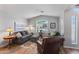 Bright living room features vaulted ceilings, a large window, and comfortable seating arrangement at 10333 E Gold Nugget Ct, Gold Canyon, AZ 85118