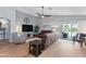 Bright living room with hardwood floors, comfortable seating, and sliding glass doors to the backyard at 10333 E Gold Nugget Ct, Gold Canyon, AZ 85118