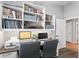 Functional home office with built-in bookshelves, desk space, and natural light at 10333 E Gold Nugget Ct, Gold Canyon, AZ 85118