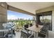 Spacious balcony with a grill, dining table, and a stunning city view, perfect for outdoor entertaining and relaxation at 1040 E Osborn Rd # 501, Phoenix, AZ 85014