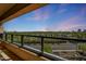 Expansive balcony view featuring a manicured golf course and distant cityscape; desert elegance at 1040 E Osborn Rd # 501, Phoenix, AZ 85014