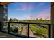 Scenic balcony view showcasing mature landscaping, a paved road, and the beautiful Arizona landscape at 1040 E Osborn Rd # 501, Phoenix, AZ 85014