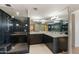 Elegant bathroom with glass shower, double vanity, dark cabinetry, and neutral tile flooring for a modern aesthetic at 1040 E Osborn Rd # 501, Phoenix, AZ 85014