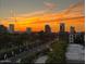 Beautiful sunset illuminating a scenic city view with palm trees and vibrant sky at 1040 E Osborn Rd # 501, Phoenix, AZ 85014