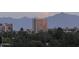 View of building with trees and mountains in the background at 1040 E Osborn Rd # 501, Phoenix, AZ 85014