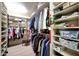 Spacious walk-in closet with custom shelving and hardwood floors at 1040 E Osborn Rd # 501, Phoenix, AZ 85014