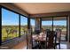 Bright dining room featuring a scenic view, wood table with chairs, and large picture window at 1040 E Osborn Rd # 501, Phoenix, AZ 85014