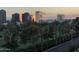 Scenic view of the golf course, lush greenery and city skyline during sunset at 1040 E Osborn Rd # 501, Phoenix, AZ 85014