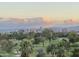 Picturesque view of a lush green golf course with the city skyline at 1040 E Osborn Rd # 501, Phoenix, AZ 85014