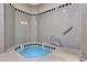 Clean jacuzzi area with grey tiling and marked water depth at 1040 E Osborn Rd # 501, Phoenix, AZ 85014