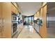 Modern kitchen with sleek wood cabinets, stainless steel appliances, and views at 1040 E Osborn Rd # 501, Phoenix, AZ 85014