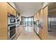 Contemporary kitchen features stainless steel appliances and modern cabinetry, perfect for cooking and entertaining at 1040 E Osborn Rd # 501, Phoenix, AZ 85014
