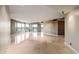 Open living area with floor-to-ceiling windows and sliding door access to a balcony overlooks the city at 1040 E Osborn Rd # 501, Phoenix, AZ 85014