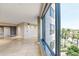 Expansive living room with large windows, tiled floors, and picturesque outdoor views at 1040 E Osborn Rd # 501, Phoenix, AZ 85014
