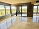 Bright living room boasts stone tiled flooring and access to a private balcony overlooking scenic views at 1040 E Osborn Rd # 501, Phoenix, AZ 85014