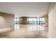 Spacious living room features tile flooring, large windows, and neutral walls in this modern condo at 1040 E Osborn Rd # 501, Phoenix, AZ 85014