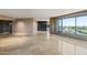 A luxurious living room featuring tile floors, recessed lighting, and windows with neighborhood views at 1040 E Osborn Rd # 501, Phoenix, AZ 85014
