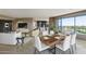 Bright and airy living room with large windows, a modern fireplace, and a stylish dining area with seating for six at 1040 E Osborn Rd # 501, Phoenix, AZ 85014