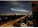 Stunning night view of the city skyline with a trail in the sky at 1040 E Osborn Rd # 501, Phoenix, AZ 85014