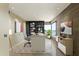 Bright office space featuring sleek built-in shelving, a spacious desk, modern decor, and abundant natural light at 1040 E Osborn Rd # 501, Phoenix, AZ 85014