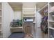 Organized walk-in closet with custom shelving and storage solutions at 1040 E Osborn Rd # 501, Phoenix, AZ 85014