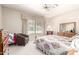 Bedroom featuring a comfortable bed, neutral color palette, and natural lighting at 11206 W Sieno Pl, Avondale, AZ 85392