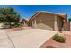 Charming home featuring a spacious driveway and a well-maintained two-car garage at 11206 W Sieno Pl, Avondale, AZ 85392