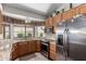 Well-equipped kitchen with granite counters, stainless steel appliances, and bright natural light at 11206 W Sieno Pl, Avondale, AZ 85392