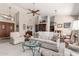 Spacious open-concept living room with comfortable seating, and an abundance of natural light at 11206 W Sieno Pl, Avondale, AZ 85392