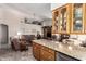 Open-concept living space with hardwood floors, vaulted ceilings, and a cozy seating area at 11206 W Sieno Pl, Avondale, AZ 85392