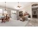 Spacious living room with ample natural light, comfortable seating, and dining area at 11206 W Sieno Pl, Avondale, AZ 85392
