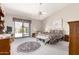 Spacious main bedroom with ceiling fan and sliding glass door to backyard at 11206 W Sieno Pl, Avondale, AZ 85392