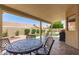 Back patio with outdoor seating and barbecue, perfect for entertaining and relaxation at 11206 W Sieno Pl, Avondale, AZ 85392
