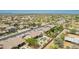 An aerial view of a beautiful property featuring a pool, desert landscaping, and neighborhood streets at 11312 E Enrose St, Mesa, AZ 85207