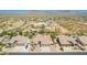 An aerial perspective of a neighborhood featuring spacious lots, desert landscaping, and attractive homes at 11312 E Enrose St, Mesa, AZ 85207