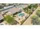 A lovely aerial view of the property showcasing a swimming pool, patio, and well-manicured backyard at 11312 E Enrose St, Mesa, AZ 85207