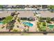 Aerial view of home with a private pool, lush landscaping, and mountain views in the background at 11312 E Enrose St, Mesa, AZ 85207