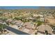 An aerial shot showcasing a neighborhood near mountainous terrain and featuring well-maintained homes at 11312 E Enrose St, Mesa, AZ 85207