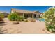 Expansive backyard with desert landscaping, patio, and pool access at 11312 E Enrose St, Mesa, AZ 85207