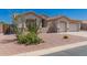 Single story home with desert landscaping including cacti, flowers, gravel and a tile roof at 11312 E Enrose St, Mesa, AZ 85207