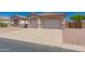 Charming single story home featuring a two car garage and desert landscaping at 11312 E Enrose St, Mesa, AZ 85207