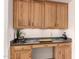 Kitchen office area with natural wood cabinetry and granite counters at 11312 E Enrose St, Mesa, AZ 85207