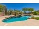 Private pool with desert landscape features and inviting blue water at 11312 E Enrose St, Mesa, AZ 85207