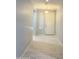 Inviting hallway with tile floors and neutral paint, leading to the front door at 1241 E Palo Verde Dr, Casa Grande, AZ 85122