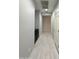 Hallway features tile floors, and access to various rooms in the home at 1241 E Palo Verde Dr, Casa Grande, AZ 85122