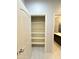 Linen closet with multiple shelves and easy access from the bathroom at 1241 E Palo Verde Dr, Casa Grande, AZ 85122