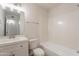 A well-lit bathroom with a vanity and bathtub at 1310 E Ironwood Dr, Buckeye, AZ 85326