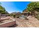 A backyard featuring a pool, patio, green space and xeriscaping at 1405 E Aloe Dr, Chandler, AZ 85286